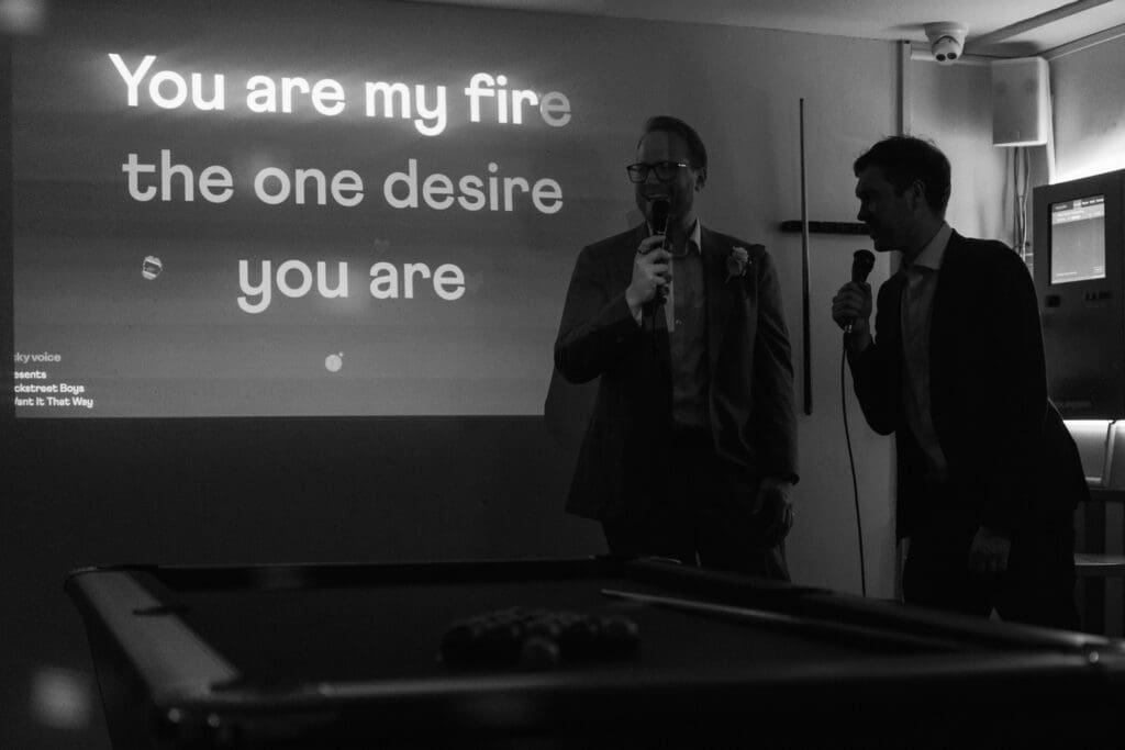 groom and best friend singing Backstreet Boys together at Sixes in London