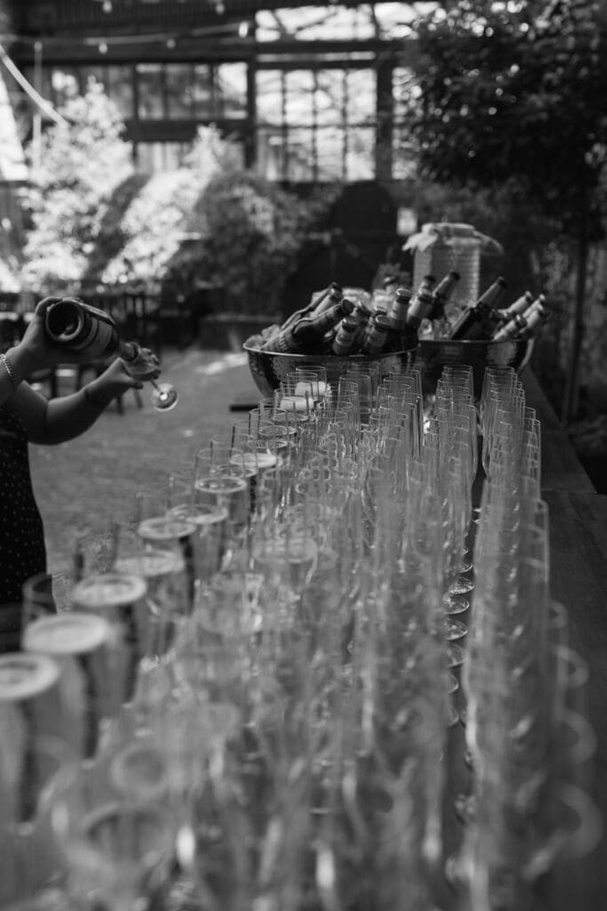 Champagne glasses lined up in The Depot courtyard before guests arrive for the celebration.